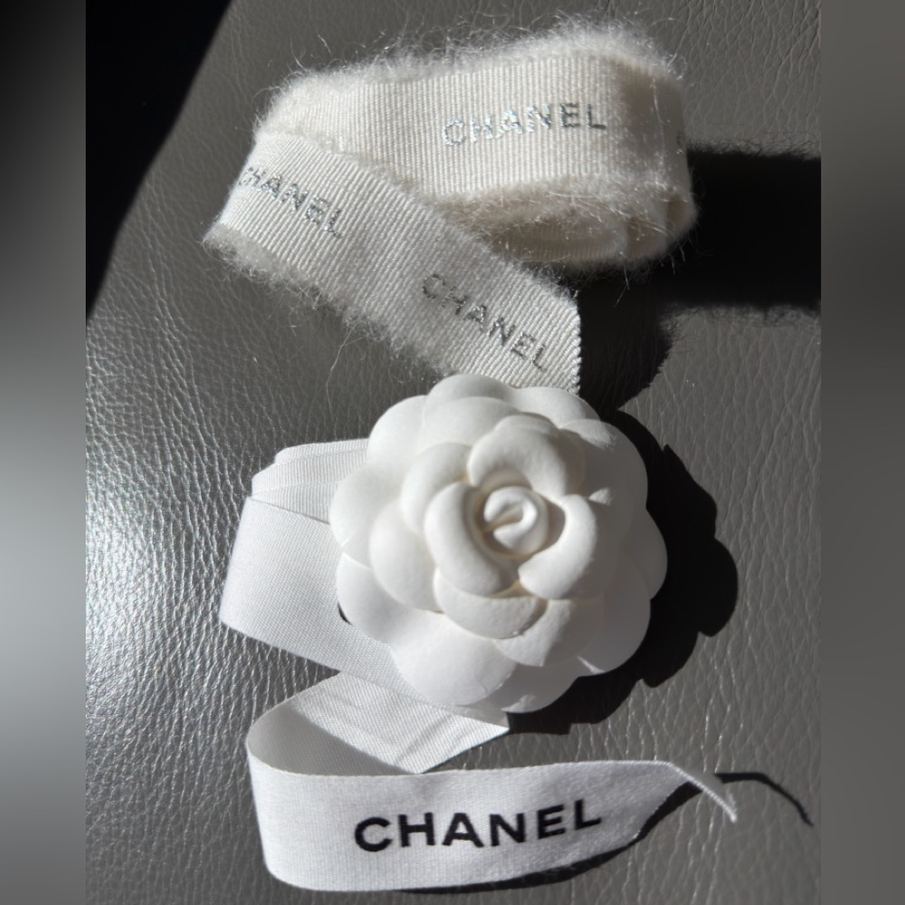 CHANEL 1 CAMELIA FLOWER AND Silver Chanel printed RIBBON,  plus Chanel card.